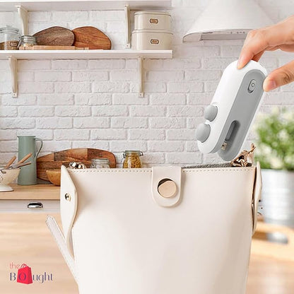 Mini sealer magnetic body attached to fridge in kitchen